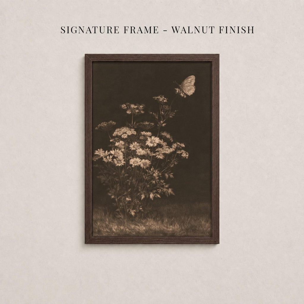 The image is a framed photograph of a flower arrangement with a butterfly in flight.
