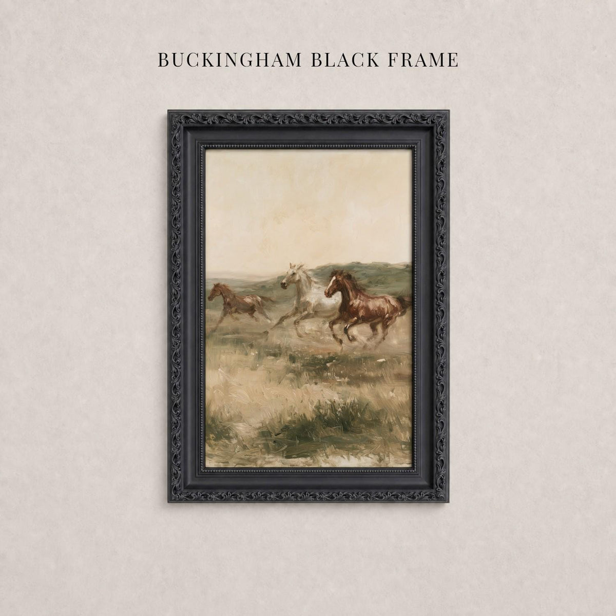 A framed painting of three horses galloping across a grassy field.