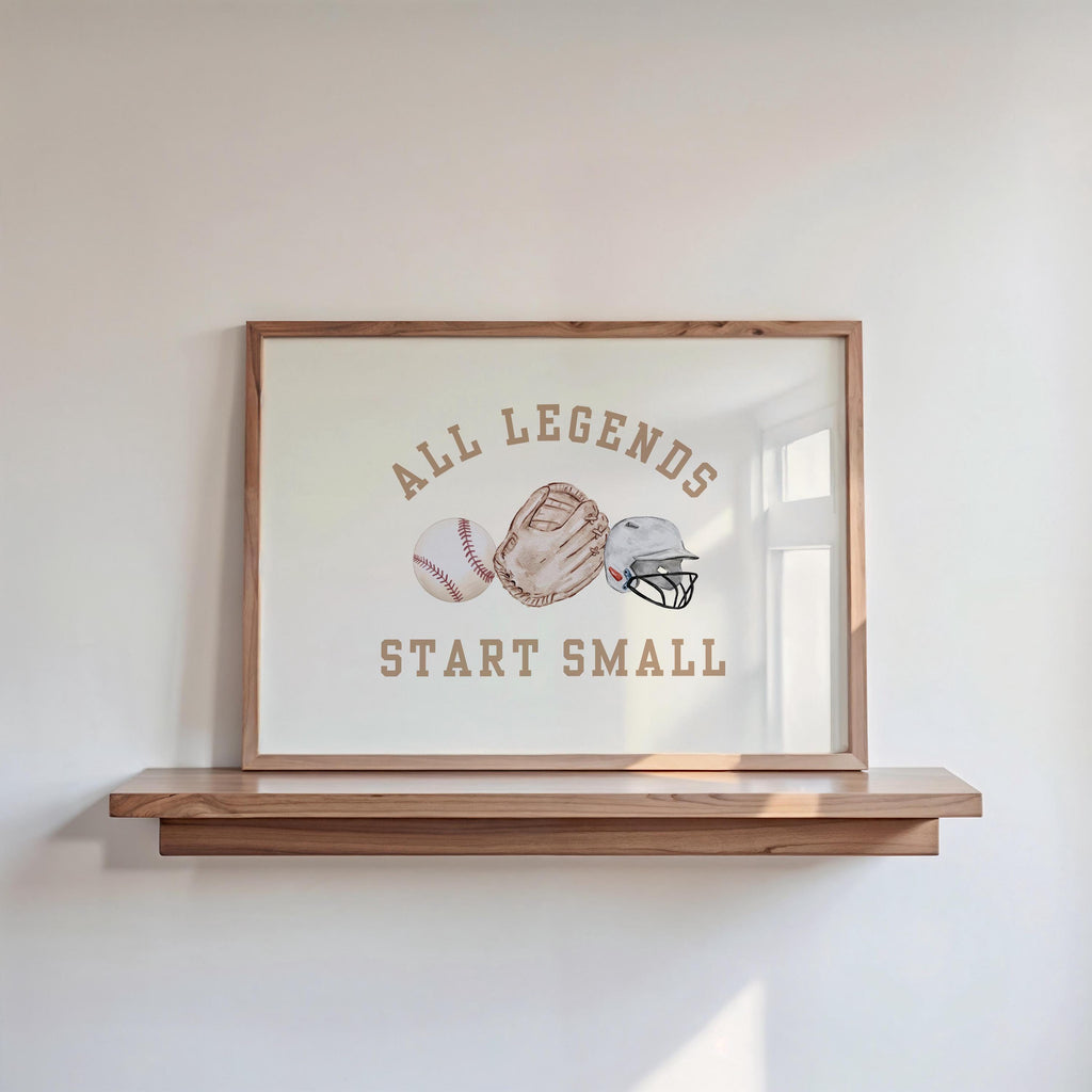 A framed poster with the text "ALL LEGENDS START SMALL" and illustrations of baseball gloves and balls.