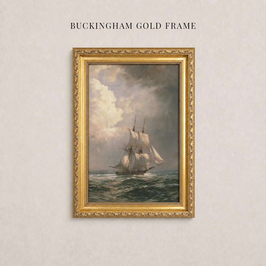 A painting of a sailing ship on the ocean, framed in a gold frame, hanging on a wall.