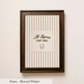 A framed picture of a baseball with the text "All Legends Start Small" on it, hanging on a wall.