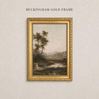 A framed landscape painting depicting a serene countryside scene with trees, a river, and a hazy sky.