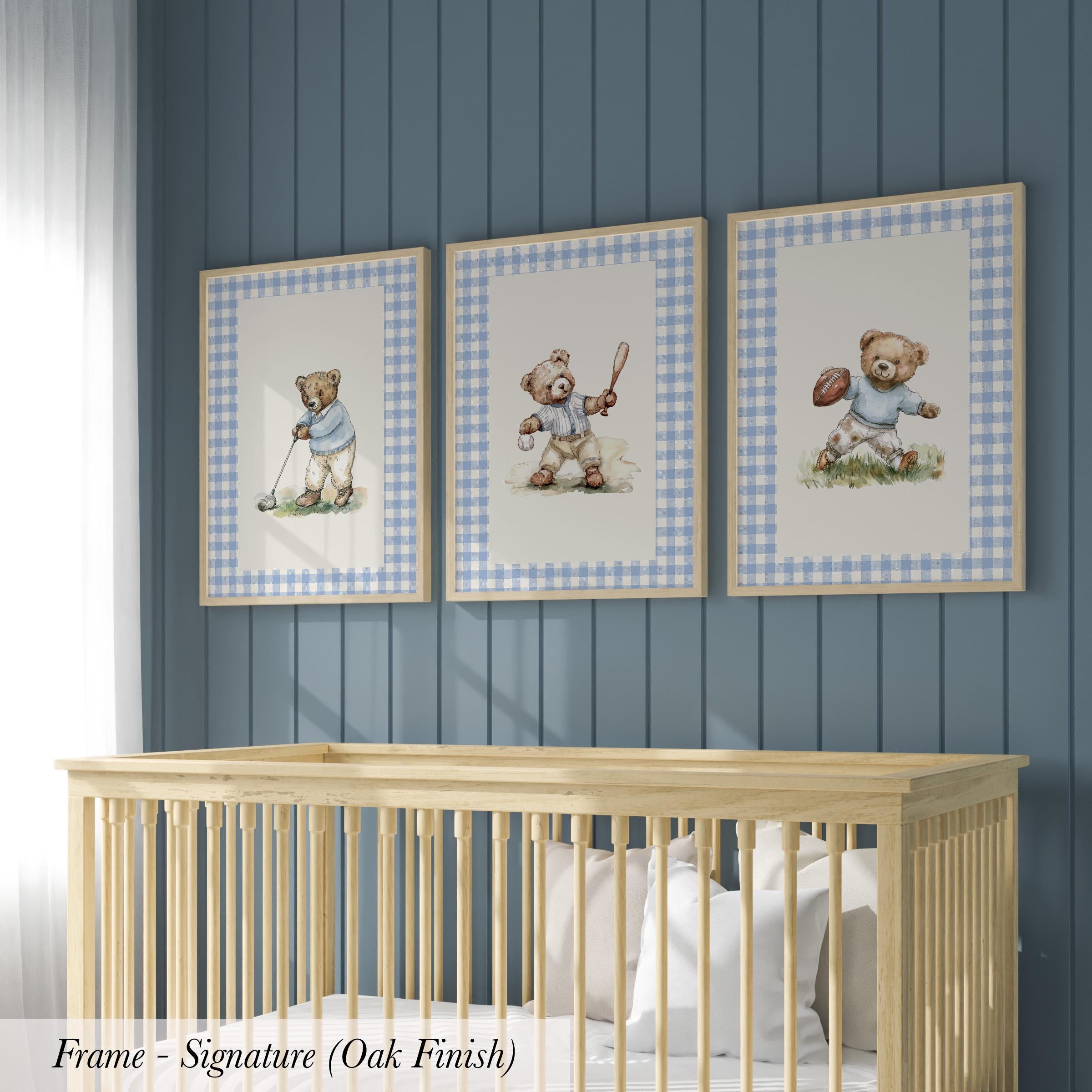 A nursery room with a wooden crib and three framed pictures of teddy bears on the wall.
