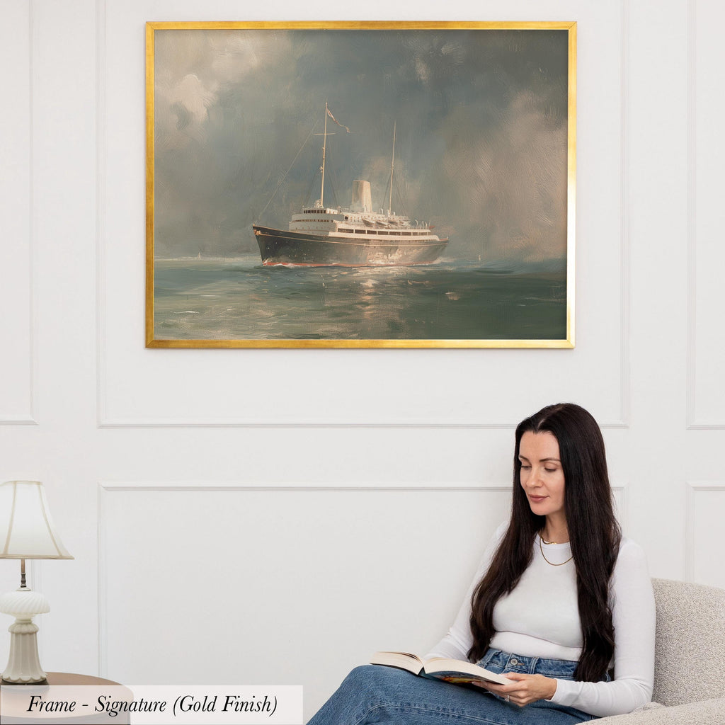 A woman is sitting on a couch and reading a book, with a painting of a ship in the background hanging on the wall above her.