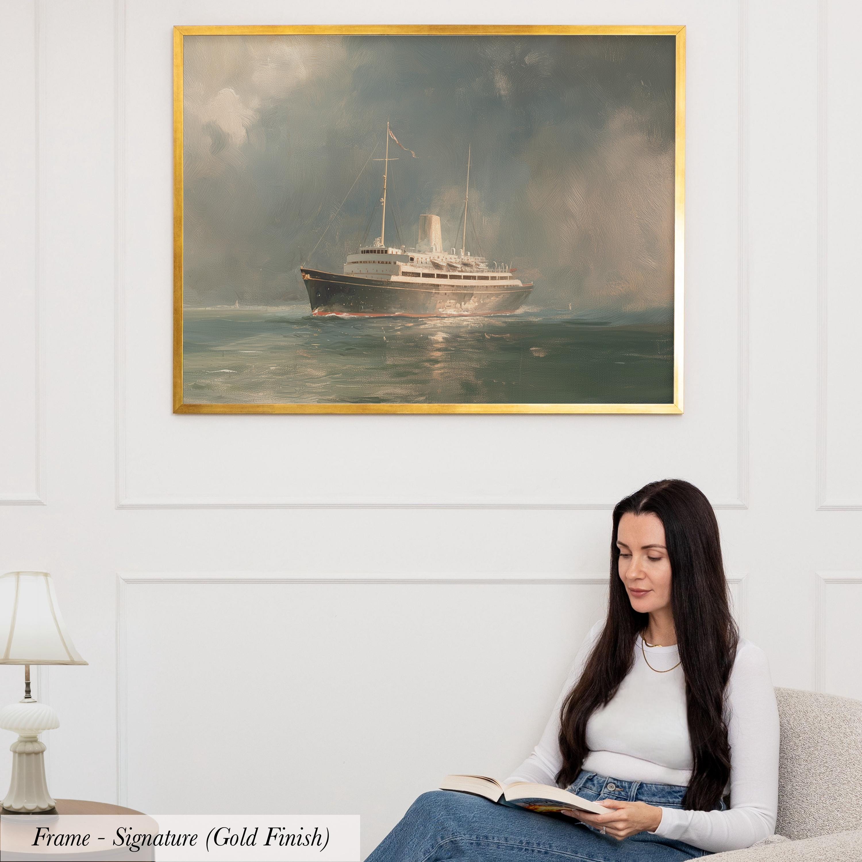 A woman is sitting on a couch and reading a book, with a painting of a ship in the background hanging on the wall above her.