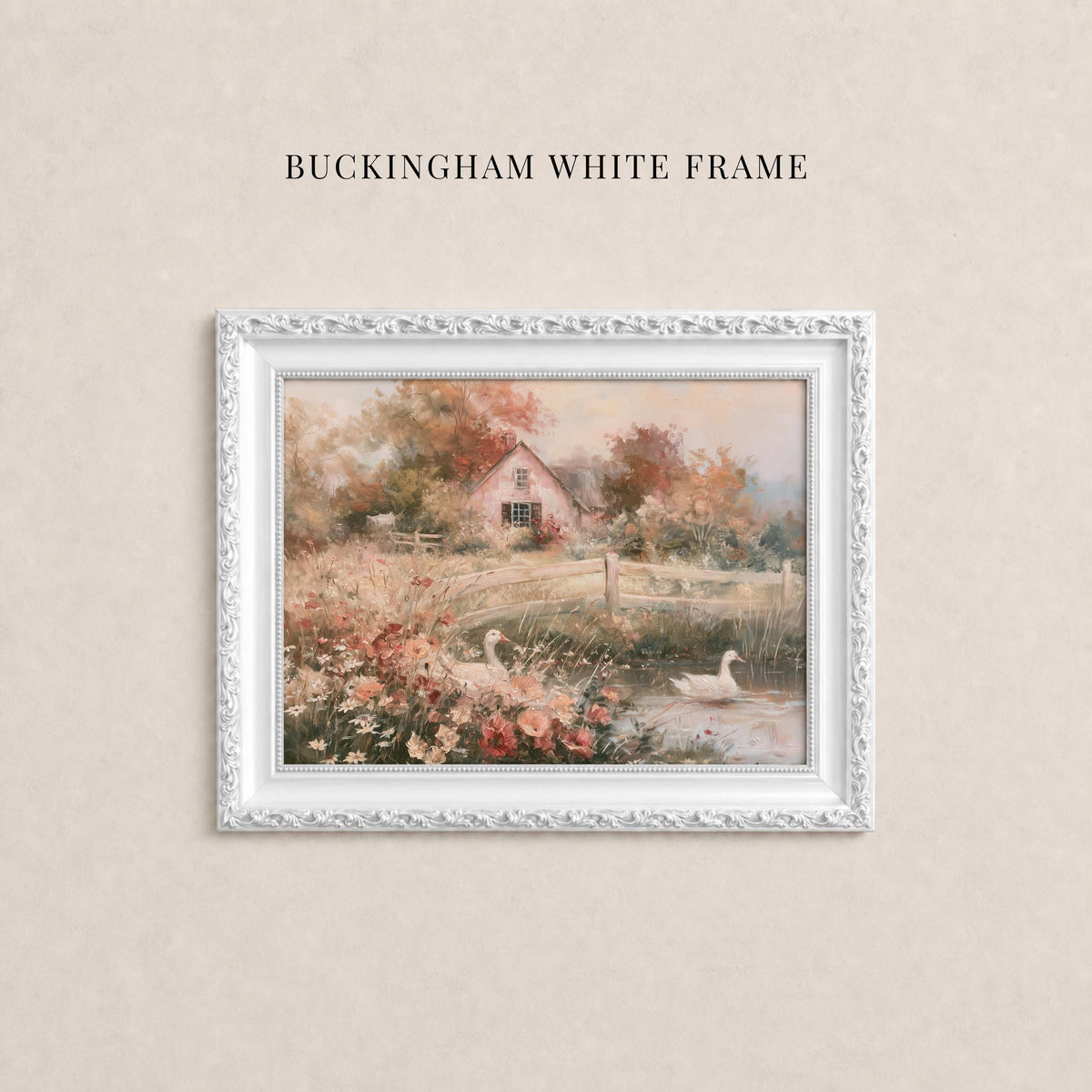 A white frame containing a painting of a serene landscape with a house, flowers, and a pond with swans.