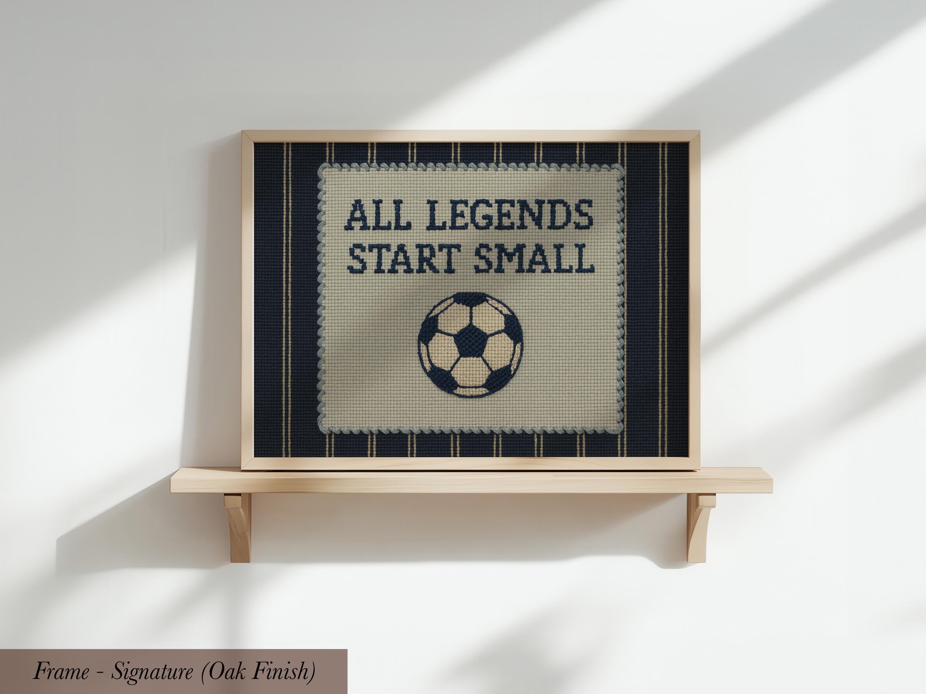 a framed poster with the text "ALL LEGENDS START SMALL" and a soccer ball graphic.