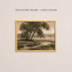 The image is a painting of a serene landscape with a river, trees, and a waterfall. The painting is framed in a gold finish, and the text above the painting reads "SIGNATURE FRAME - GOLD FINISH".