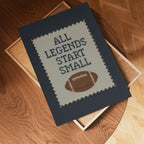 a framed cross-stitch design with the text "All Legends Start Small" and a football graphic.