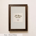A framed picture with a baseball and the text "All Legends Start Small" on it, hanging on a wall.
