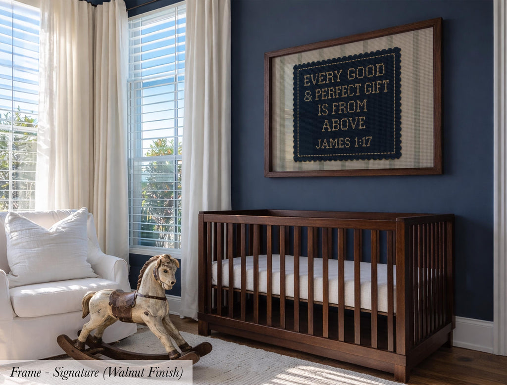 a nursery room with a wooden crib, a rocking horse, and a framed sign on the wall.