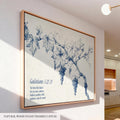 a large framed canvas depicting a blue and white illustration of a grape vine with leaves and grapes. The text below the illustration reads "Galatians 5:22-23".