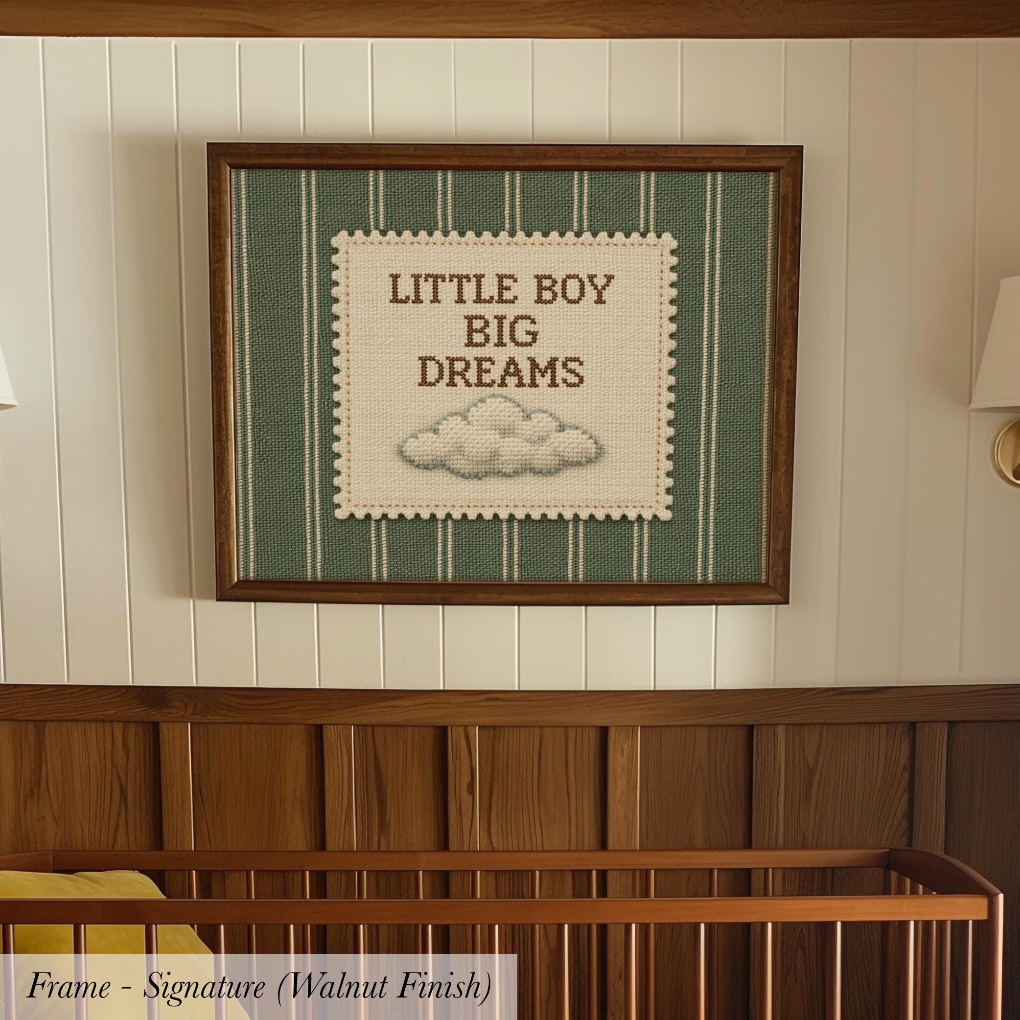 A framed wall hanging with the text "LITTLE BOY BIG DREAMS" and a cloud illustration.