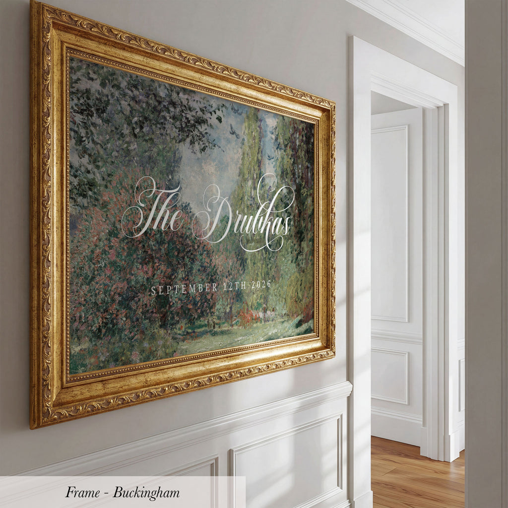 a large, ornate gold frame hanging on a white wall.