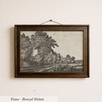 The image is a framed bronze-colored painting depicting a landscape with trees and a road.