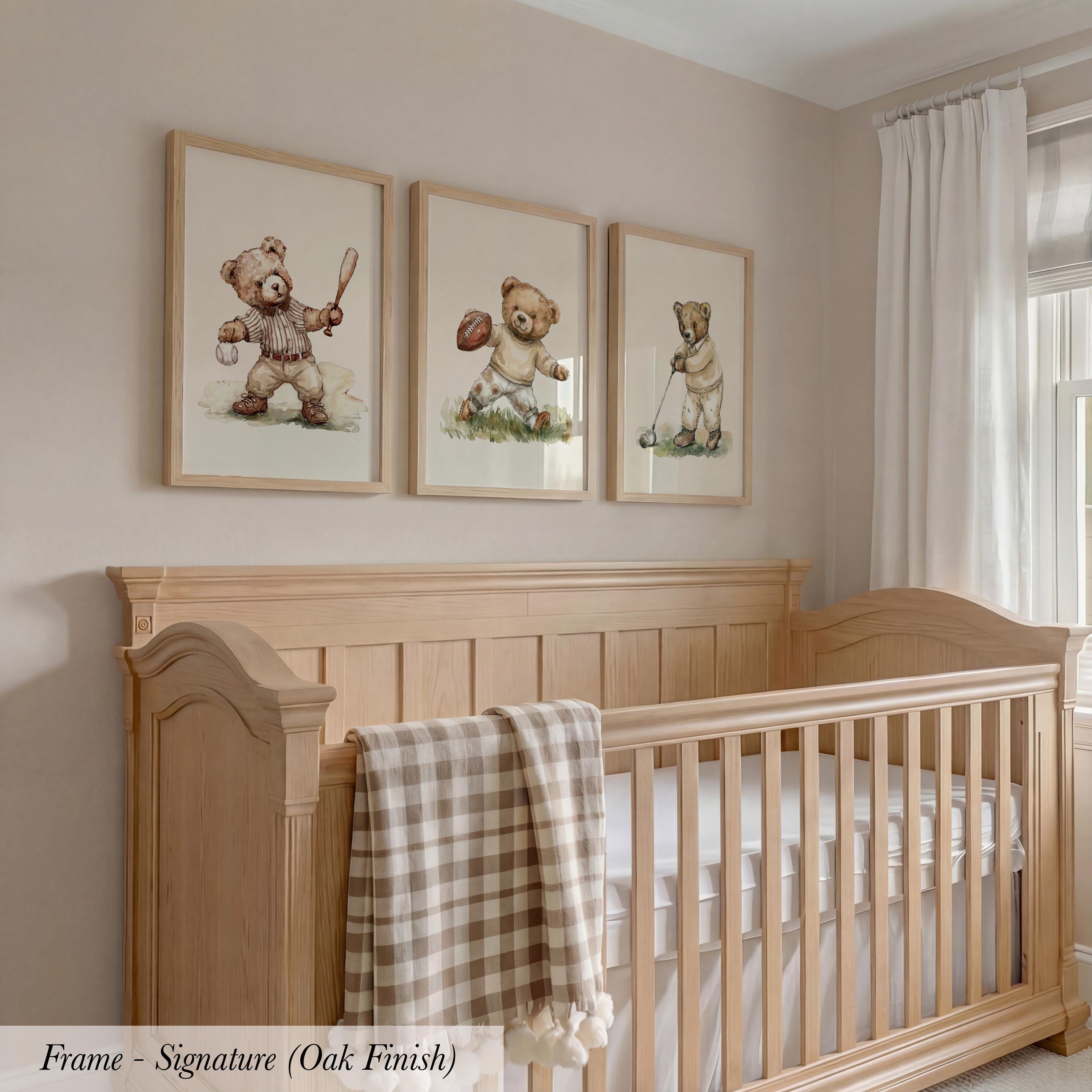 A wooden crib with three framed teddy bear illustrations on the wall above it.