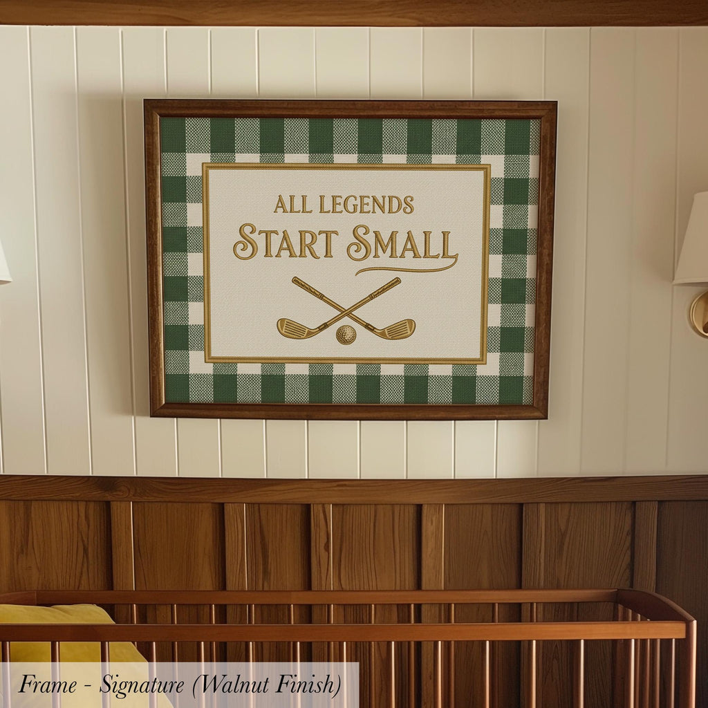 A framed sign with the text "ALL LEGENDS START SMALL" is hanging on a wall above a wooden crib.
