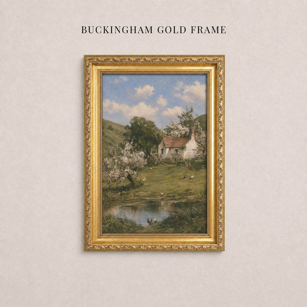 A painting of a rural landscape with a pond, trees, and a house in the background, framed in a gold frame.
