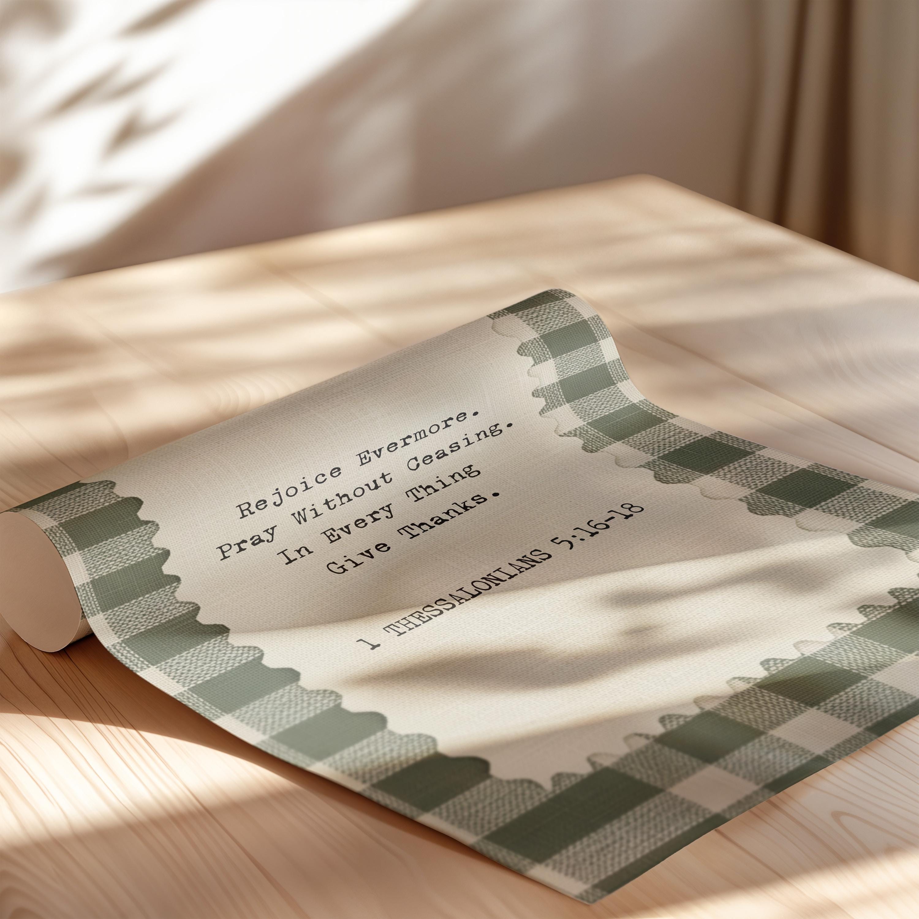 a rolled-up paper with a religious message on it, placed on a wooden surface.