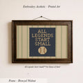 a framed embroidered piece of art with the text "ALL LEGENDS START SMALL" and a baseball motif.