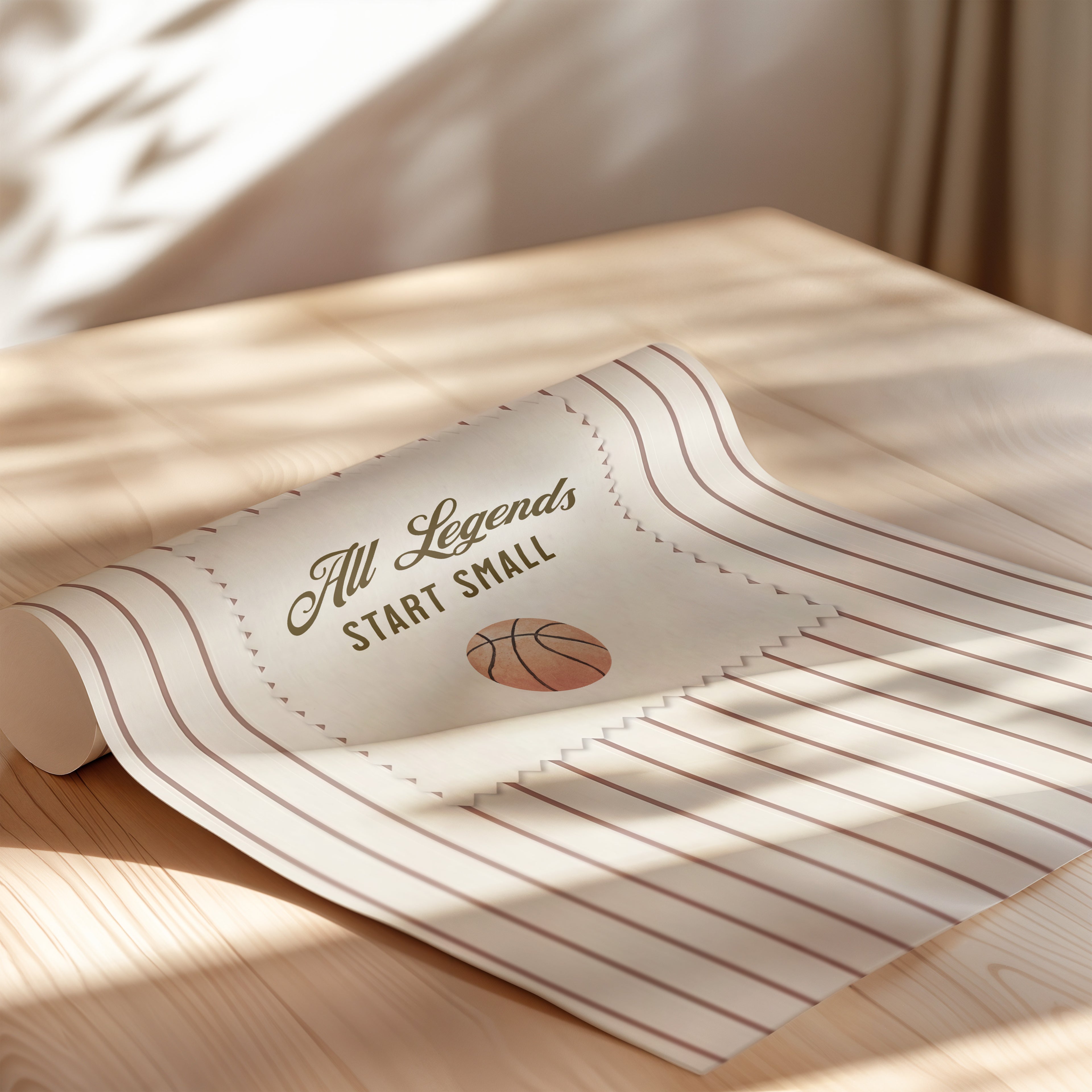 A rolled-up piece of paper with the text "All Legends Start Small" printed on it, along with a basketball graphic.