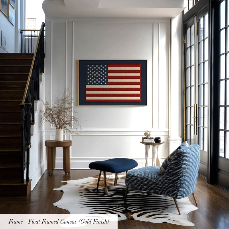 a modern living room with a large American flag painting on the wall, a blue armchair, a wooden side table, and a zebra print rug.