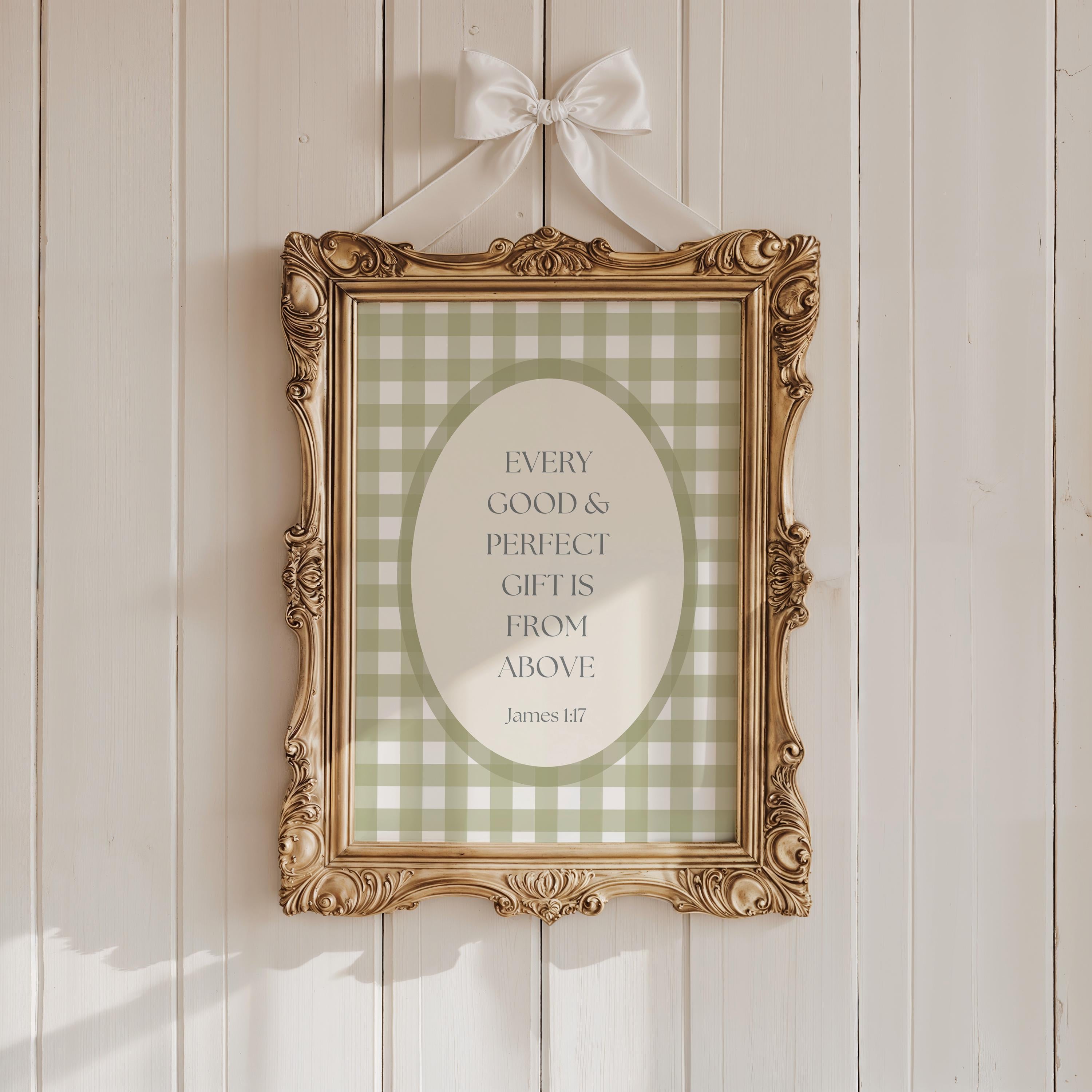a gold-framed picture hanging on a white wooden wall. The picture has a green and white checkered pattern and contains a quote about gifts from above.