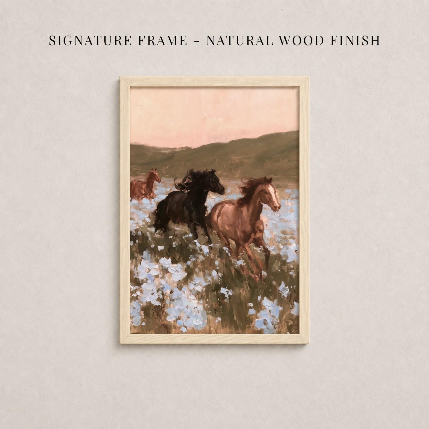 The image is a framed painting depicting a group of horses running through a field with flowers.