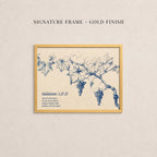 The image is a framed print featuring a blue and white illustration of grapes and leaves on a branch.