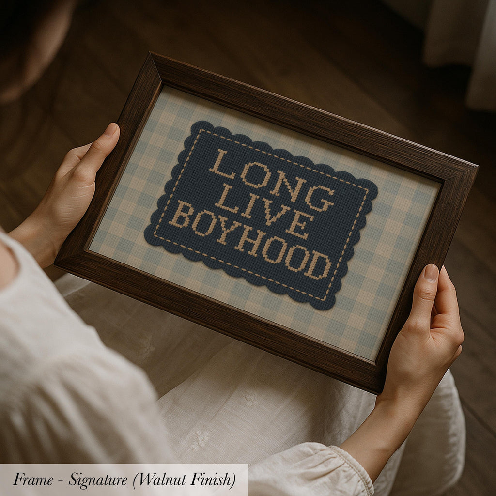 A person is holding a framed picture with the text "LONG LIVETHOOD" on it.