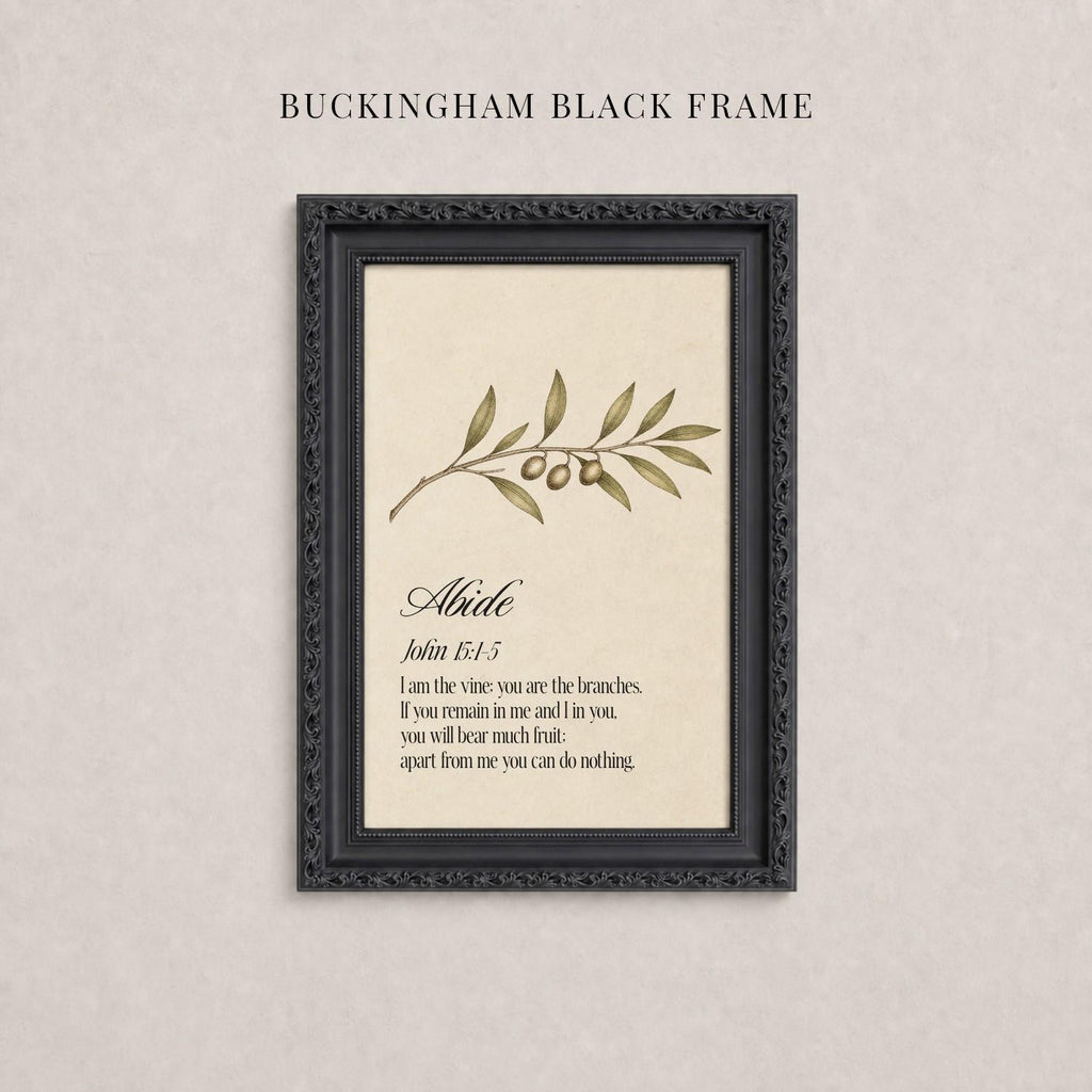 The image is a framed print with a black border and a beige background. The print features a branch with leaves and small green fruits, and it contains a biblical verse from the book of John.