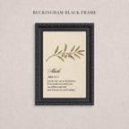 The image is a framed print with a black border and a beige background. The print features a branch with leaves and small green fruits, and it contains a biblical verse from the book of John.