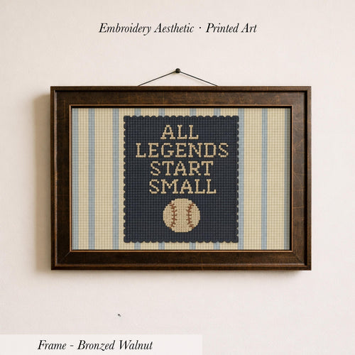 a framed embroidered design with the text "ALL LEGENDS START SMALL" and a baseball graphic.