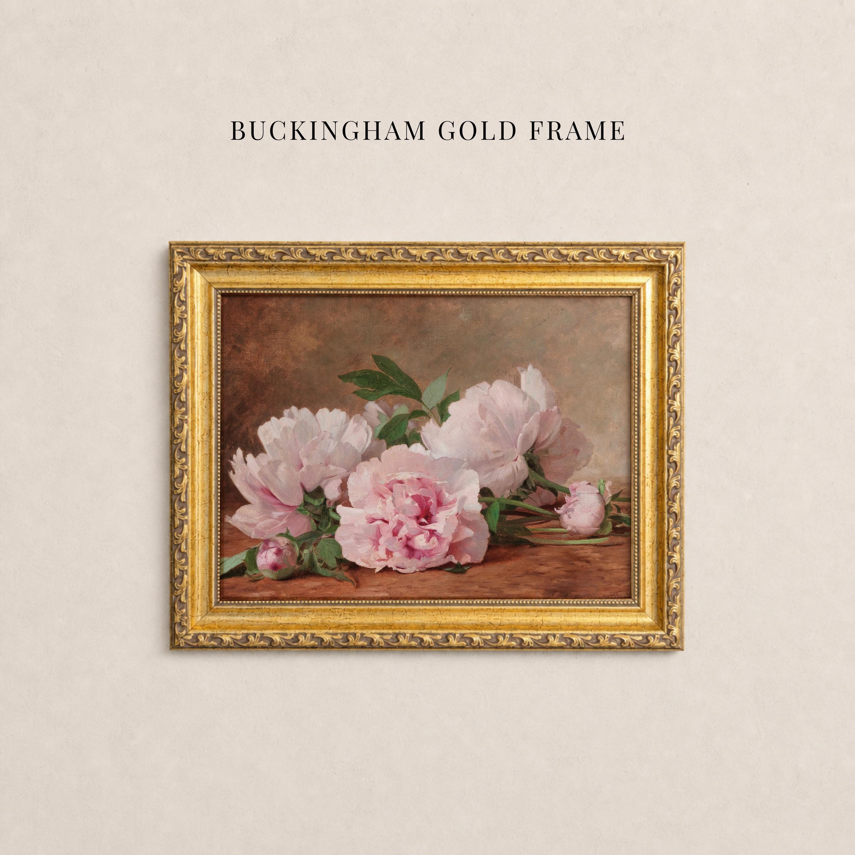 May include: A rectangular ornate gold frame containing a painting of light pink peony flowers with green leaves against a dark brown background. The text BUCKINGHAM GOLD FRAME is printed in black capital letters above the framed artwork.