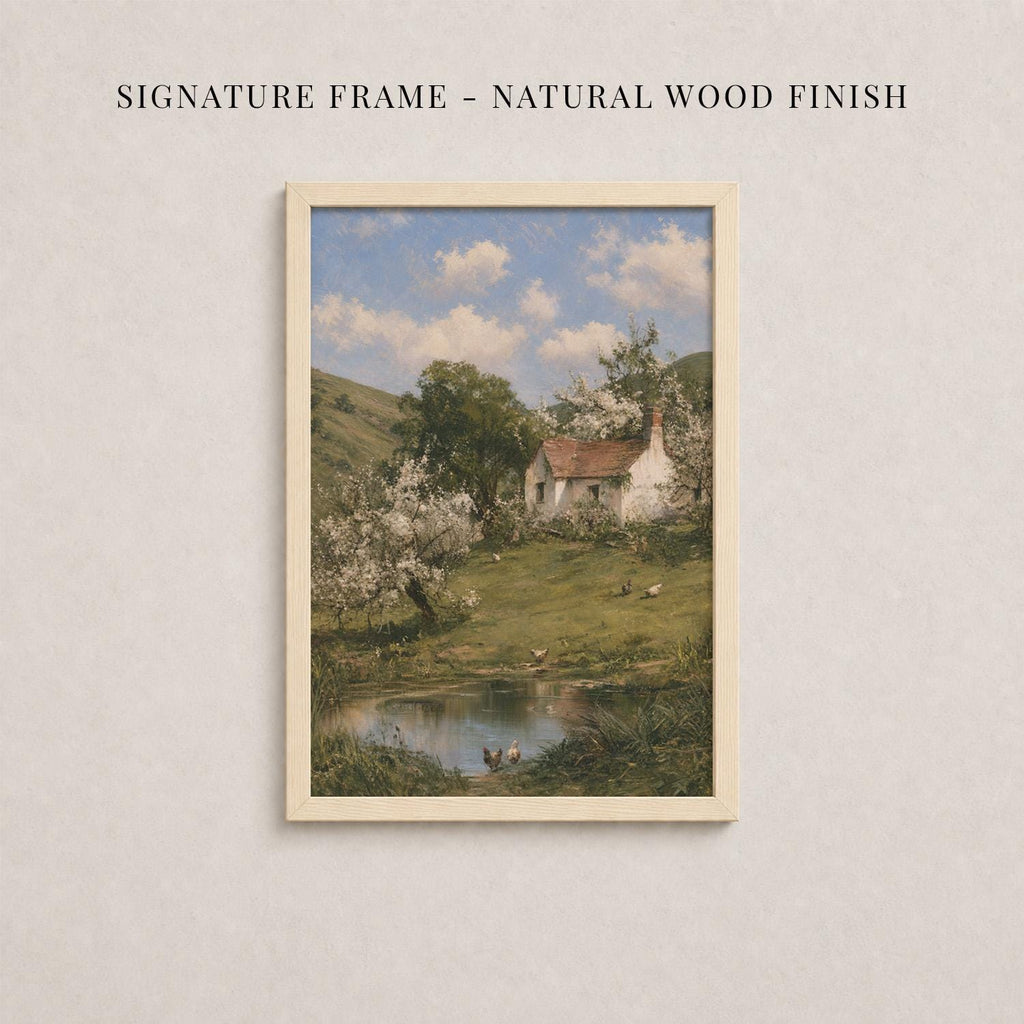 The image is a framed painting depicting a serene countryside scene with a small white house nestled among lush greenery and a tranquil pond.