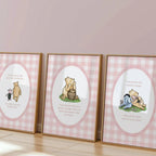 three framed prints of Winnie the Pooh illustrations, each with a different scene depicted.