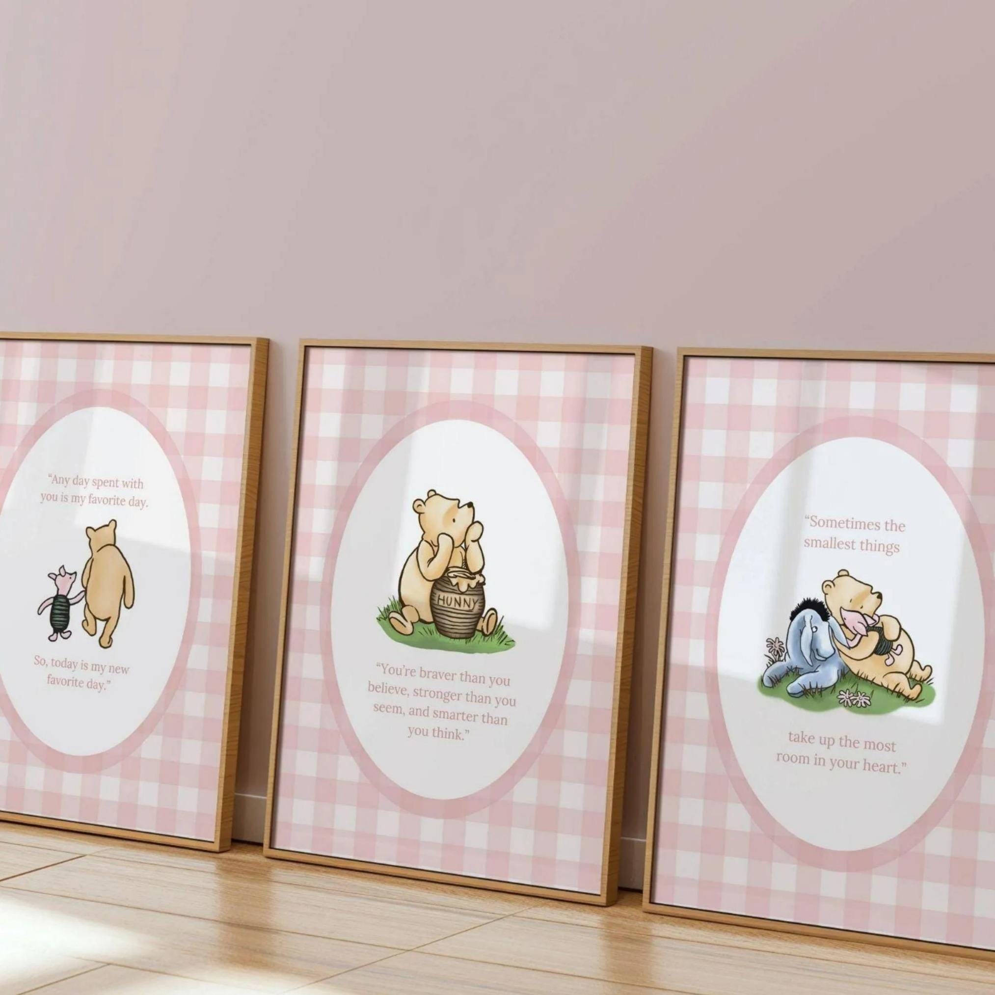 three framed prints of Winnie the Pooh illustrations, each with a different scene depicted.