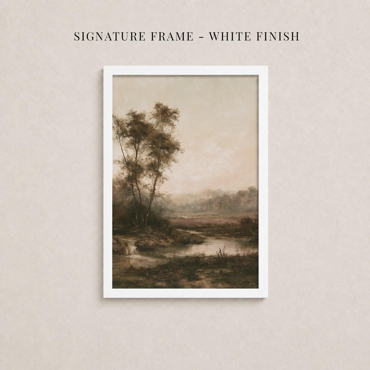 The image is a framed painting depicting a serene landscape with trees, a river, and a hazy sky.