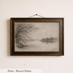 A framed painting of a tree on a lake, depicting a serene landscape.