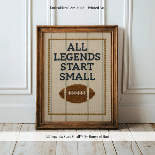 a framed embroidered cross-stitch design with the text "ALL LEGENDS START SMALL" and a football motif.