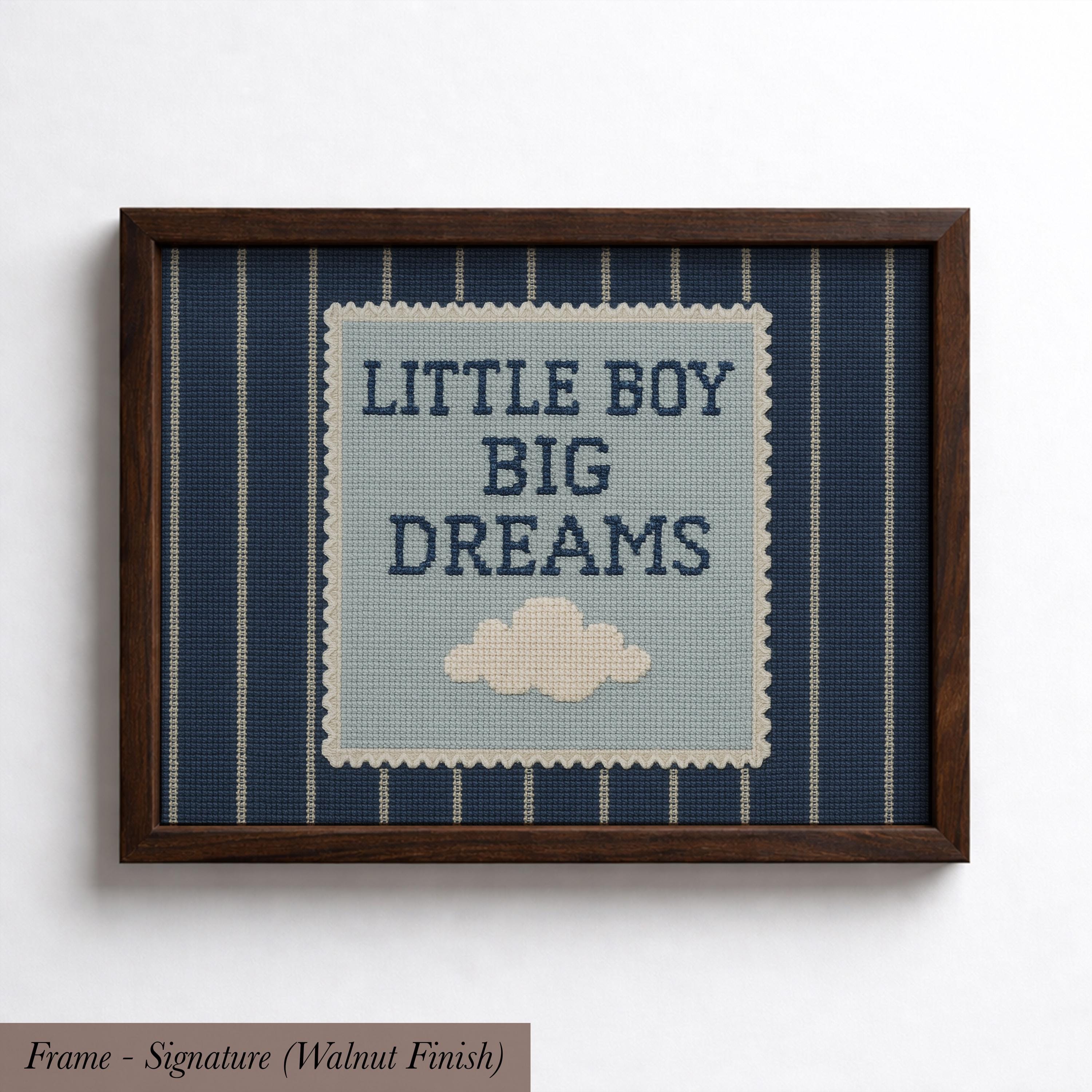 The image is a framed piece of art with a blue background and a white cloud. The text on the art piece reads "LITTLE BOY BIG DREAMS".