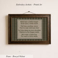 a framed print with a poem or lyrics, hanging on a wall.