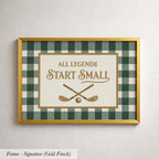 a framed sign with the text "ALL LEGENDS START SMALL" and a graphic of a golf club and ball.