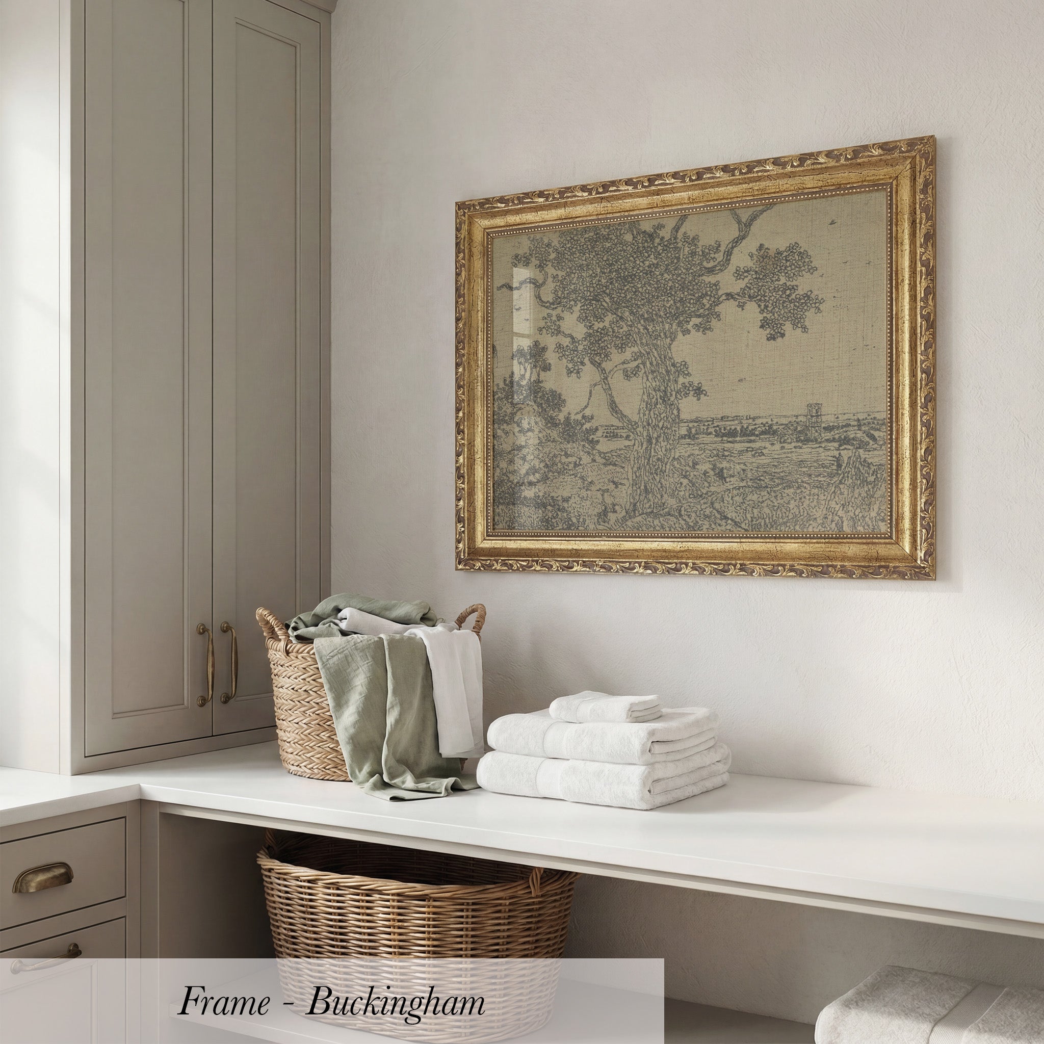 a white shelf with a wicker basket and a stack of folded towels, along with a framed picture hanging on the wall above the shelf.