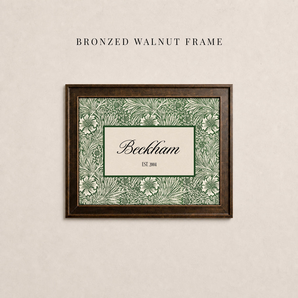 May include: A rectangular bronzed walnut frame containing a print with a green and cream floral pattern. The center features a cream rectangle with a dark green border, displaying the text Beckham and the smaller text EST. 2004 in black.