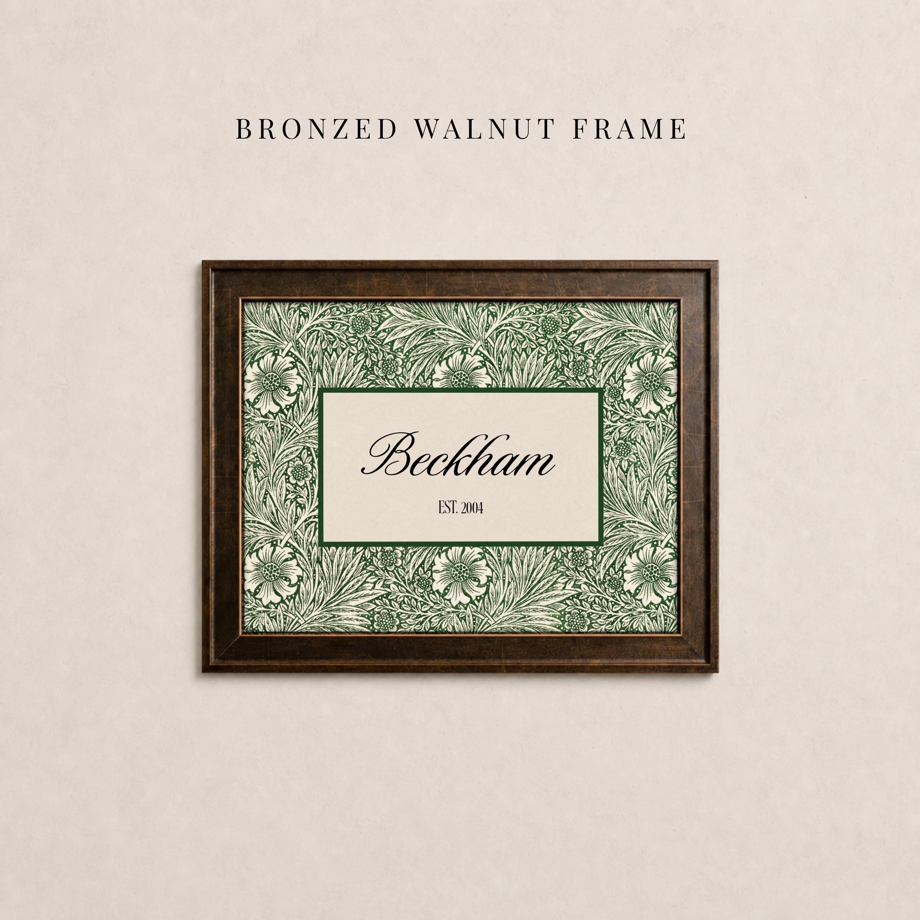 May include: A rectangular bronzed walnut frame containing a print with a green and cream floral pattern. The center features a cream rectangle with a dark green border, displaying the text Beckham and the smaller text EST. 2004 in black.