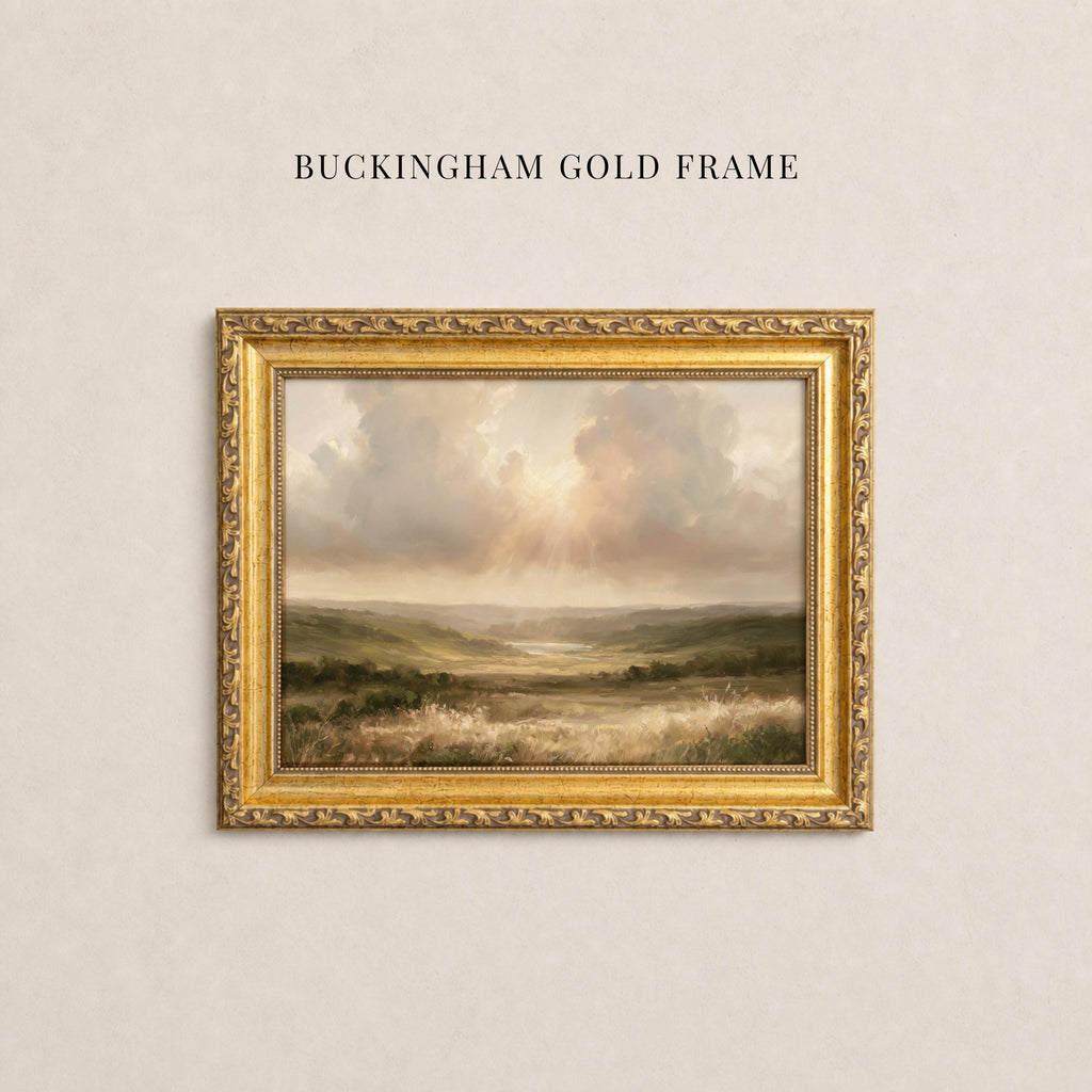 May include: A landscape painting in a decorative gold frame with the text BUCKINGHAM GOLD FRAME above it. The artwork depicts a grassy valley under a cloudy sky with light rays breaking through. The frame features an ornate, textured border.