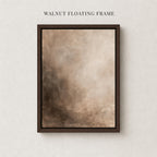 The image is a square painting or artwork with a dark brown frame, hanging on a white wall.