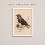 The image is a framed artwork depicting a black bird perched on a branch with flowers.