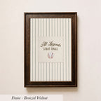 A framed picture of a baseball with the text "All Legends Start Small" displayed on it.